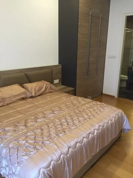 Bedroom features: king-size bed with beige bedding, upholstered headboard, wooden flooring, built-in wardrobe with wood finish, nightstand with lamp, white painted walls, decorative wall paneling, doorway leading to bathroom; style: modern.