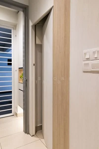 Room features: light-colored painted walls, wood paneling, white tiled flooring, modern light switches, sliding door, built-in storage closet, minimalist design; style: modern.