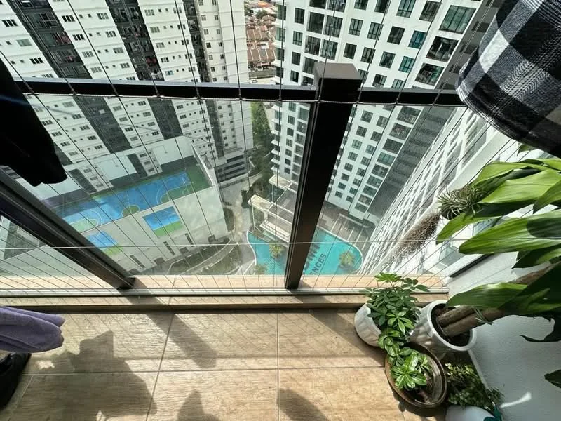 Balcony features: glass railing, wooden flooring, potted plants, view of swimming pool, view of surrounding buildings, clothes hanging on railing; style: modern; view: pool.