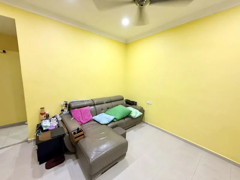 Living features: light grey leather sectional sofa, yellow painted walls, white ceiling, ceiling fan, tile flooring, small side table, decorative cushions in green and pink, wall-mounted electrical outlets; style: modern.