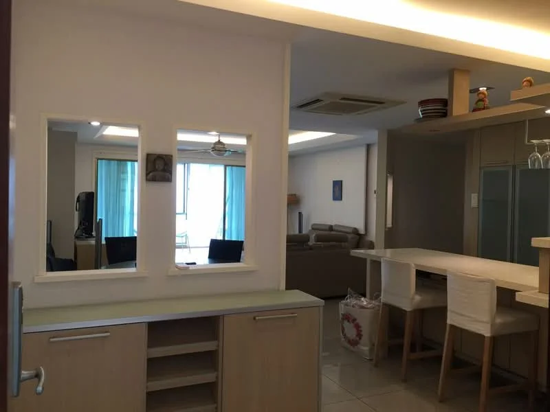 Room features: white painted walls, tile flooring, recessed downlights, ceiling fan, open-plan layout, kitchen island with seating, mirrored wall, large windows with sheer curtains, dining area, living area with sofa, decorative items on shelves; style: modern; view: city.