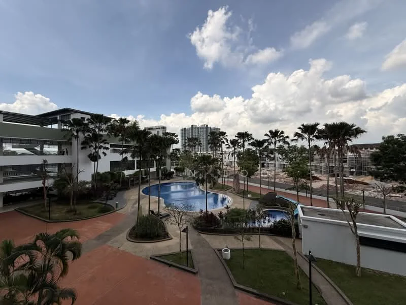 Exterior type: high-rise condominium; features: infinity pool, landscaped garden, palm trees, manicured lawn, pool deck with loungers, children's playground, surrounding greenery, modern architecture, construction site in background; style: modern.