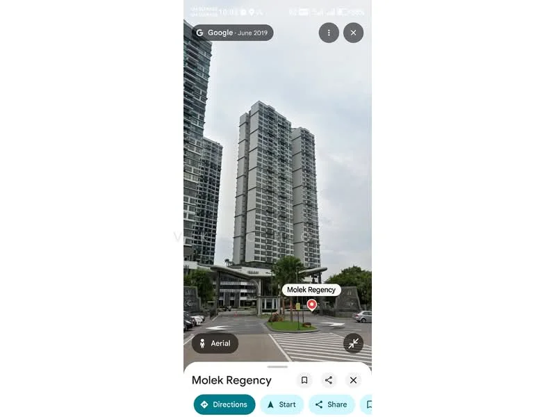 Exterior type: high-rise condominium; features: glass curtain wall, multiple-storey structure, landscaped entrance, surrounded by greenery, pedestrian crosswalk, parking area, modern architectural design; style: modern.