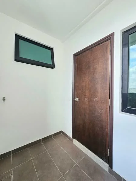 Room features: white painted walls, brown wooden door, small window with green frame, grey tiled flooring, corner wall, natural light from window.