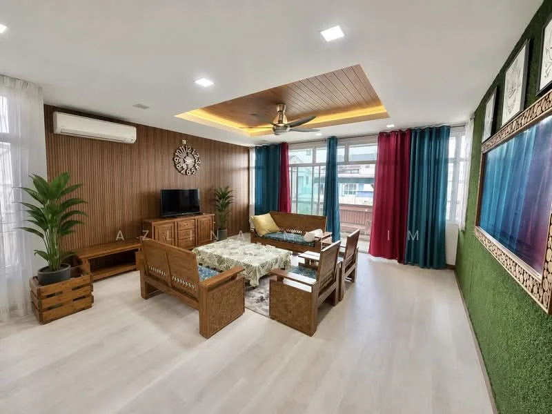 Living features: wooden ceiling with recessed lighting, 5-blade ceiling fan with light, large windows with sheer curtains, green accent wall with decorative panels, light-colored wooden flooring, brown wooden furniture set, coffee table with decorative tablecloth, TV console with wall-mounted TV, indoor plants in decorative pots, blue and red curtains, wall-mounted artwork; style: modern.