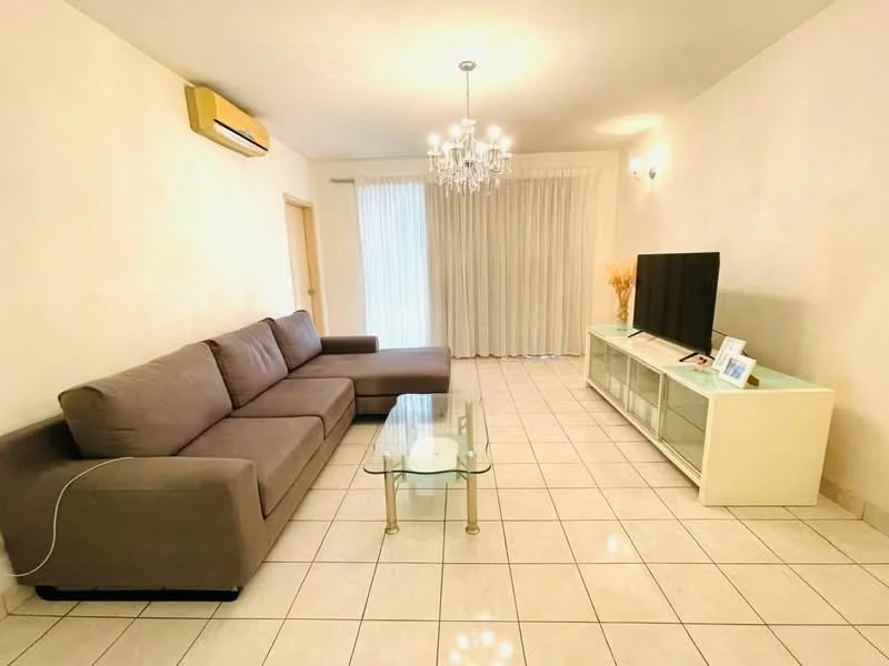 Living features: L-shape sectional sofa in grey, glass coffee table, white TV console, wall-mounted TV, floor-to-ceiling windows with sheer curtains, recessed downlights, 1 wall-mounted split AC, cream painted walls, tile flooring, decorative wall art; style: modern.