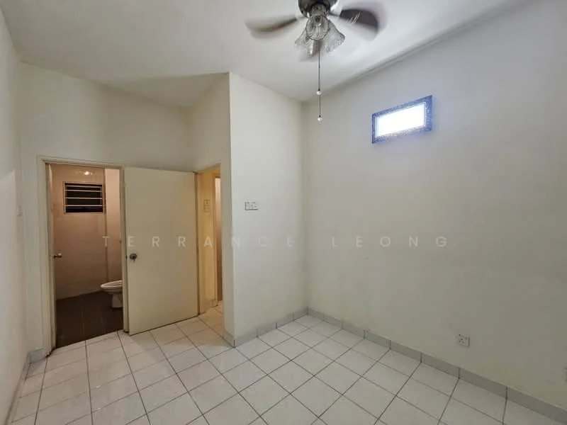 Room features: white painted walls, ceiling fan, tile flooring, small window, doorway leading to bathroom, light switch, corner room, neutral color scheme.