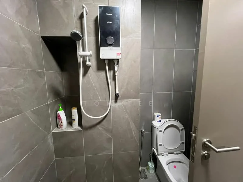 Bathroom features: grey tiled walls, grey tiled flooring, walk-in shower with glass enclosure, rain shower head, handheld shower, toilet, wall-mounted shower heater, toiletries on shelf; style: modern.