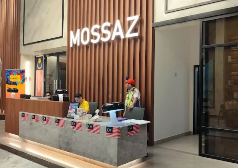 Exterior features: reception desk with wood paneling, illuminated signage, marble flooring, large glass windows, decorative wall art, flag decorations, security personnel, seating area, modern design elements; style: modern.