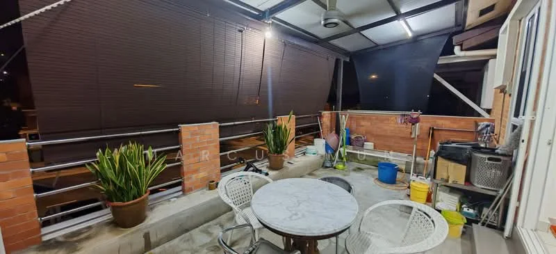 Room features: outdoor seating area with round marble table, two chairs, brick walls, potted plants, concrete flooring, overhead roof, roller blinds, various cleaning tools, plastic buckets, garden hose.