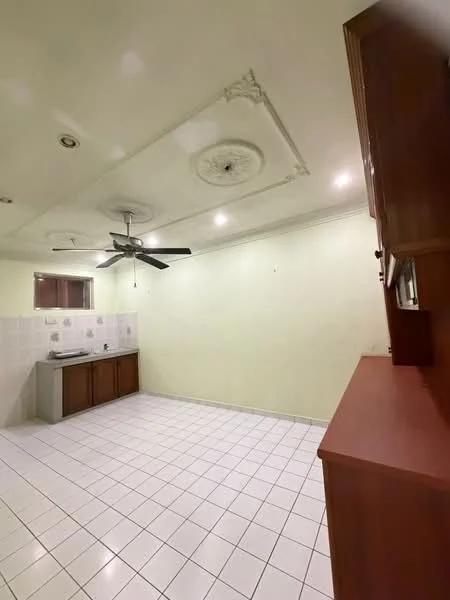 Kitchen features: white painted walls, ceiling with decorative moulding, 5-blade ceiling fan, white tiled flooring, wood cabinetry, stainless-steel sink, countertop, wall-mounted cabinets.