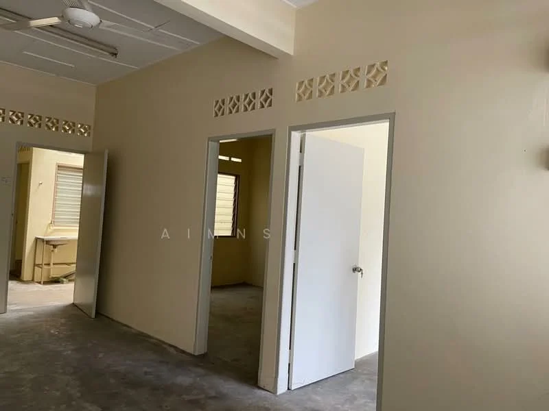 Room features: cream painted walls, concrete flooring, white doors, ceiling fan, window with blinds, doorway leading to another room, decorative wall vents.
