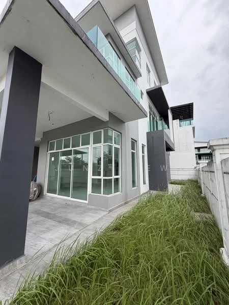 Exterior type: detached bungalow; features: two-storey building, glass windows, grey painted facade, balconies with glass railings, manicured lawn, paved walkway, modern architectural design, surrounded by greenery; style: modern.