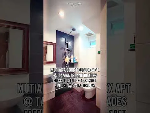 Bathroom features: white tiled walls, grey tiled flooring, single-sink vanity with wood cabinet, chrome basin mixer faucet, framed mirror, one-piece toilet, shower with glass enclosure, handheld shower, built-in shelving, towel rack; style: modern.