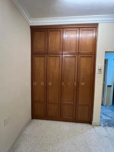 Room features: built-in wooden wardrobe with multiple doors, light-colored walls, textured ceiling with crown moulding, speckled flooring, wall-mounted electrical outlet; style: modern.