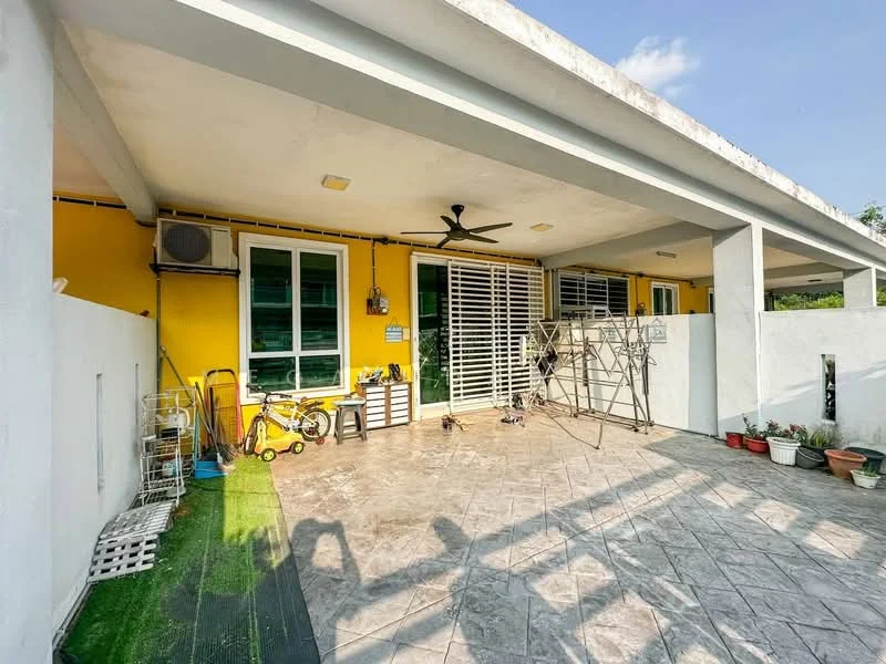 Room features: yellow painted walls, grey tiled flooring, ceiling fan, sliding glass door, window with white shutters, outdoor storage rack, decorative potted plants, green grass mat, children's tricycle, metal drying rack; style: modern; view: garden.