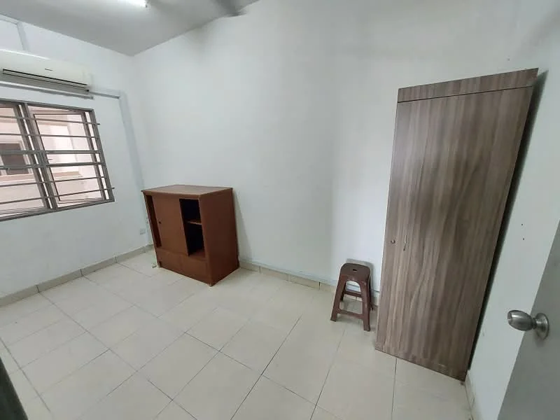 Room features: white painted walls, tile flooring, window with metal grille, air conditioning unit, wooden cabinet, wooden stool, corner wardrobe, neutral color scheme; style: minimalist.