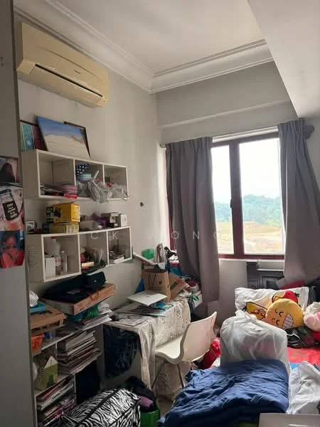 Room features: wall-mounted split AC, grey painted walls, floor-to-ceiling window, curtains, wooden shelving unit, cardboard boxes, cluttered floor, bed with bedding, stuffed toys, plastic chair, table with items, decorative items on shelves.