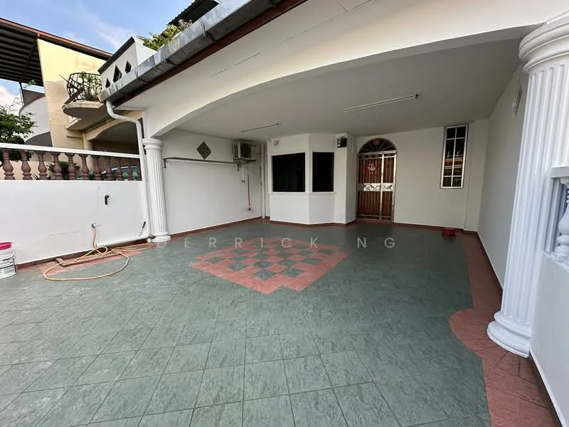 Exterior type: linked terrace house; features: covered porch area, green ceramic tile flooring, red decorative tile pattern, white painted walls, two wall-mounted split AC units, arched entrance, columns at entrance, outdoor lighting fixtures, fenced boundary, open space, access to upper floors; style: modern.