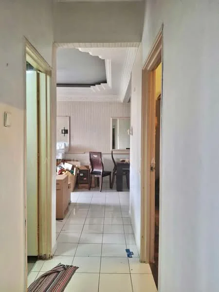 Room features: white painted walls, ceramic tile flooring, crown moulding, door frames, light switch, visible furniture, boxes, dining table, chairs.
