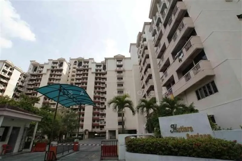 Exterior type: mid-rise condominium; features: white painted facade, multiple storeys, balconies on upper floors, palm trees in landscaping, covered entrance with awning, security gate at entrance, manicured lawn, driveway with interlocking pavers; style: modern.