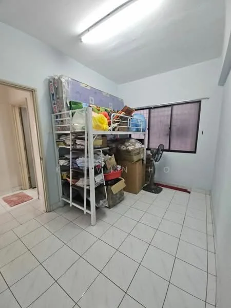 Room features: white painted walls, tile flooring, single window, bunk bed frame, stacked storage boxes, standing fan, cluttered storage, light fixture on ceiling.