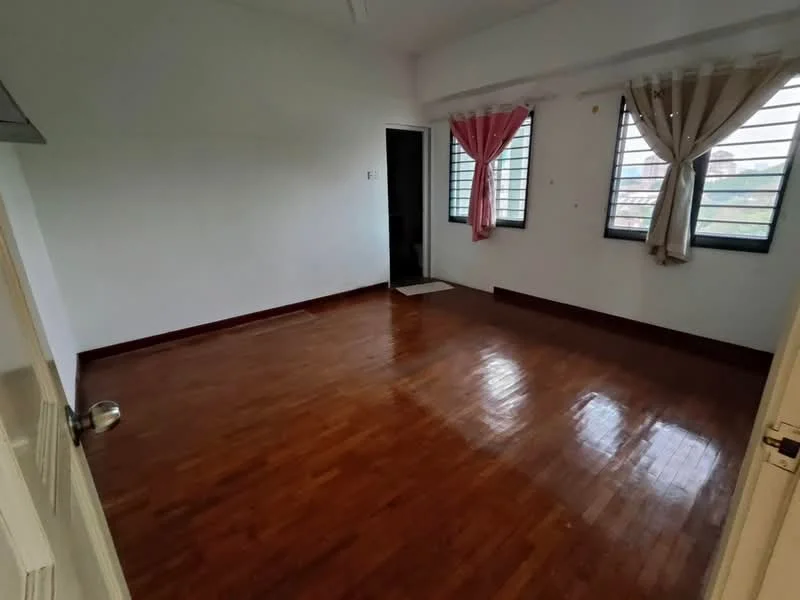 Room features: wooden flooring, white painted walls, two windows with metal grilles, curtains in pink and sheer fabric, single door leading to hallway, no visible furniture, light source from windows, empty space; style: minimalist; view: garden.