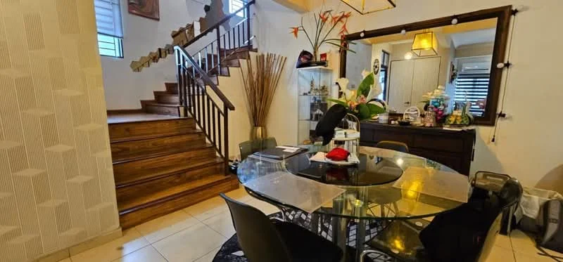Dining features: round glass dining table, black dining chairs, wooden flooring, cream tiled flooring, decorative wall with geometric pattern, large mirror, hanging pendant light, decorative plants, wooden staircase, sideboard cabinet, wall-mounted artwork; style: modern.