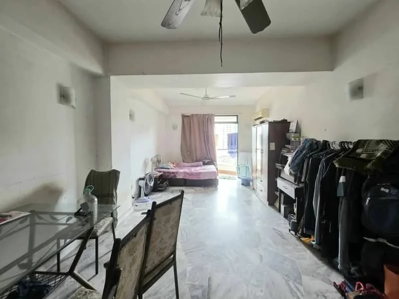 Living features: marble flooring, white painted walls, 5-blade ceiling fan, large window with sheer curtains, double bed with pink bedding, wardrobe with sliding doors, dining table with metal frame and glass top, chairs with fabric upholstery, clothes rack with various garments.