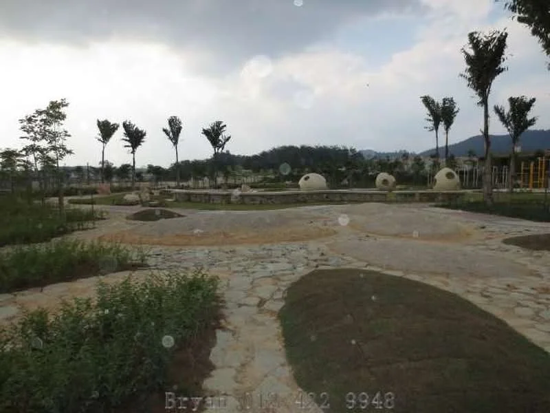Exterior type: landscape garden; features: manicured lawn, mature trees, stone-paved walkway, playground equipment, landscaped hills, open grassy areas, scenic mountain view, pathways, decorative dome structures; style: modern.