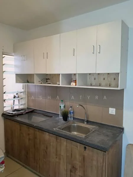 Kitchen features: single-bowl stainless-steel sink, chrome pull-down faucet, grey granite countertop, white upper cabinets, wooden lower cabinets, tile backsplash, two bottles of water on countertop, plant decoration, window with horizontal slats; style: modern.
