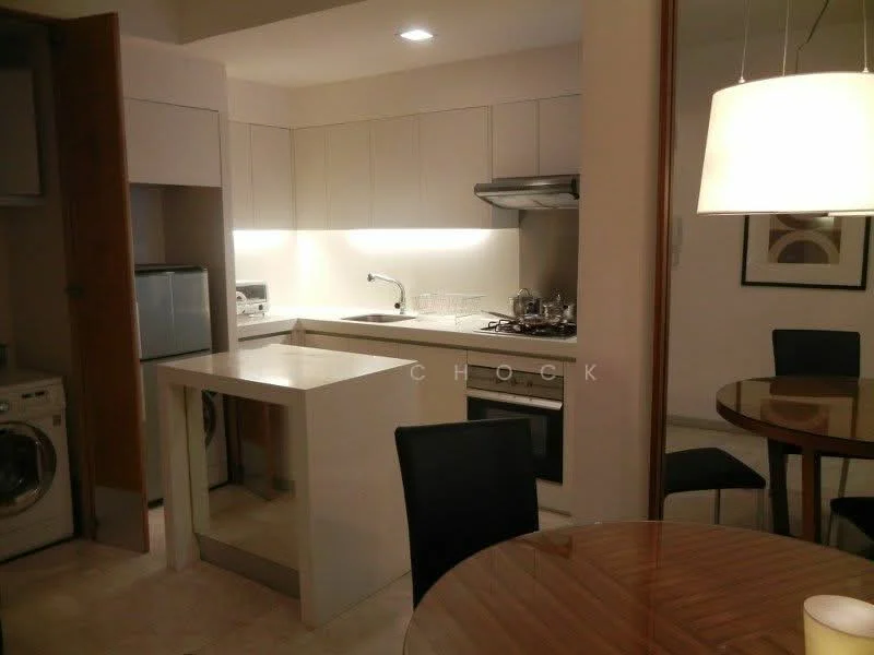 Kitchen features: white cabinetry, stainless-steel sink, chrome pull-down faucet, built-in oven, stainless-steel range hood, 4-burner gas hob, microwave, refrigerator, washer-dryer combo, breakfast bar, pendant light, tile backsplash, marble countertop, ceramic tile flooring; style: modern.