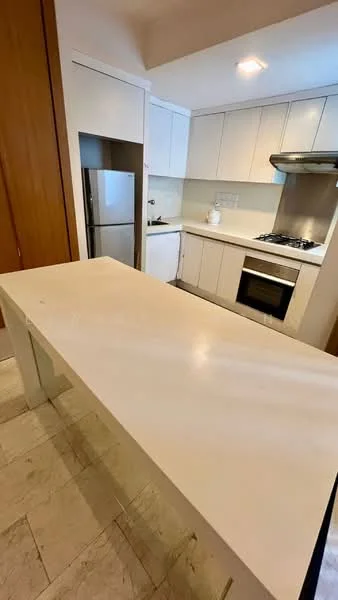 Kitchen features: white cabinetry, stainless-steel fridge, built-in oven, gas hob, white countertop, marble tile flooring, recessed downlights, kitchen island, white backsplash, sink, chrome faucet; style: modern.