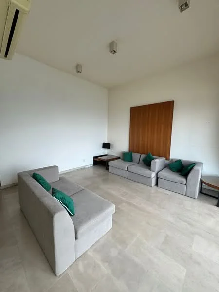 Living features: light grey fabric sofa, 2-seater sofa, 3-seater sofa, green accent cushions, wooden wall panel, light-colored stone flooring, recessed ceiling lights, wall-mounted TV console, small desk, air conditioning unit; style: modern.