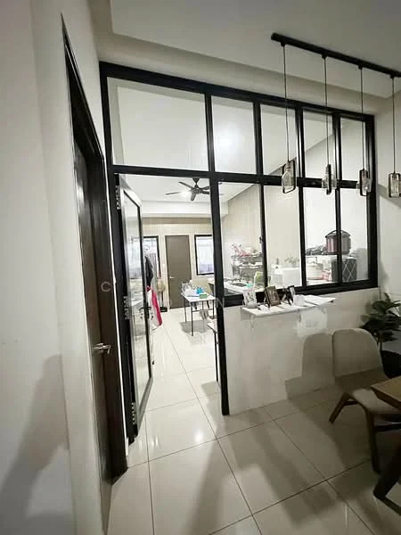 Room features: glass partition wall, white painted walls, tile flooring, ceiling fan, hanging pendant lights, door with glass panel, open layout, decorative plants, furniture visible in background; style: modern.