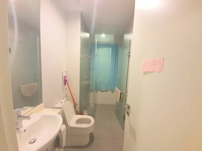 Bathroom features: white tiled walls, grey floor tiles, single-sink vanity with countertop, mirror above sink, one-piece toilet, walk-in shower with glass enclosure, shower head, curtain for shower, towel rack, toilet paper holder; style: modern.