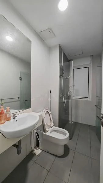 Bathroom features: white ceramic toilet, single-sink vanity with white countertop, mirror above sink, glass shower enclosure, rain shower head, handheld shower, grey tile flooring, white tiled walls, recessed lighting; style: modern.