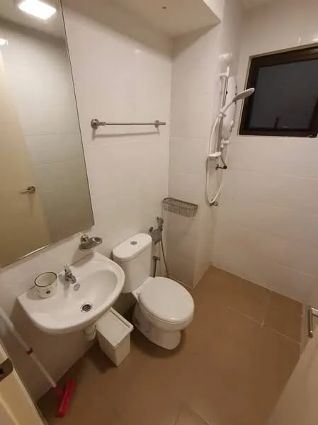 Bathroom features: white tiled walls, beige tile flooring, single-sink vanity with mirror, chrome basin mixer faucet, one-piece toilet, handheld shower, shower head mounted on wall, towel rack, small storage basket, window with dark frame; style: modern.