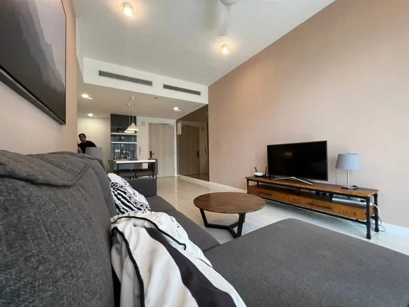 Living features: grey fabric sectional sofa, round wooden coffee table, wall-mounted flat-screen TV, wooden TV console, light grey wall, recessed ceiling lights, ceiling fan, open layout to dining area, white tiled flooring, decorative wall art, black and white throw pillows; style: modern.