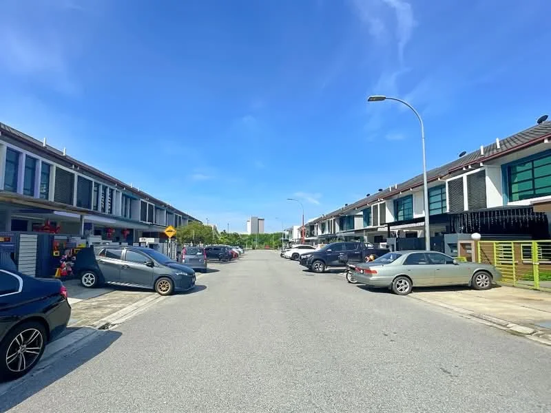 Exterior type: linked terrace house; features: two-storey linked terrace houses, modern facade with large windows, driveway with interlocking pavers, manicured landscaping, street lighting, open parking spaces, surrounded by greenery, clear blue sky, urban residential area; style: modern.