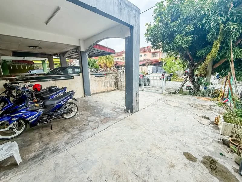 Exterior type: car porch; features: concrete flooring, covered car porch, space for multiple vehicles, fenced perimeter, mature trees, garden area, adjacent residential buildings, outdoor lighting; style: modern.