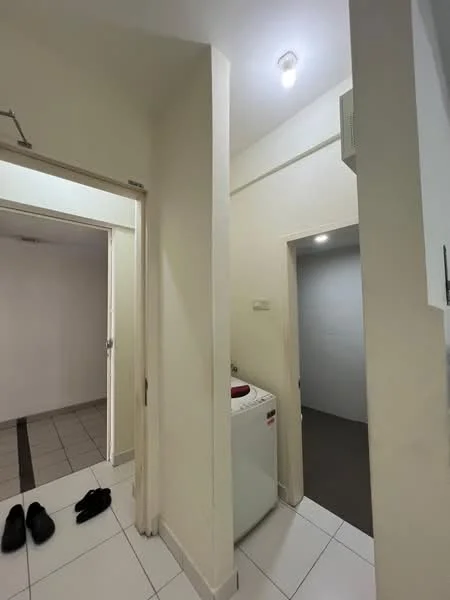 Laundry features: white washing machine, white tiled flooring, light beige painted walls, ceiling light, doorway to adjacent room, doorway to hallway. Room features: grey carpet flooring, light beige painted walls, ceiling light.
