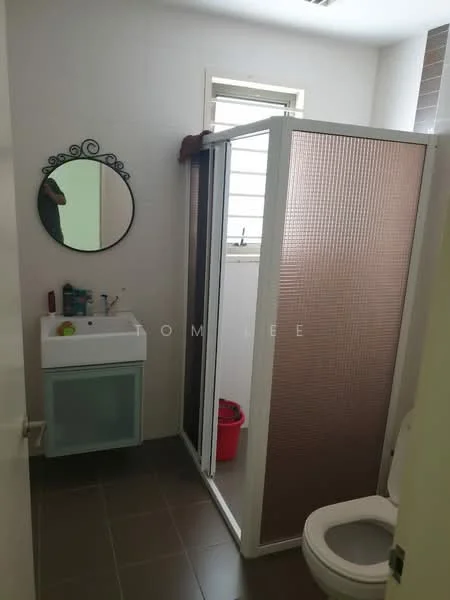 Bathroom features: single-sink vanity with wood cabinet, framed mirror, shower with glass enclosure, one-piece toilet, tile flooring, white painted walls, window for natural light, red bucket, toiletries on vanity; style: modern.