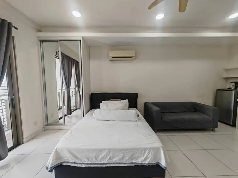 Bedroom features: queen-size bed with white bedding, grey fabric sofa, floor-to-ceiling sliding mirror wardrobe, wall-mounted air conditioning unit, white tiled flooring, recessed ceiling lights, blackout curtains, balcony door, small fridge; style: modern.