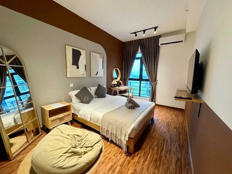 Bedroom features: king-size bed with white bedding, upholstered headboard, two grey decorative pillows, wooden bedside table, round mirror on wooden stand, floor-length mirror, beige area rug, bean bag chair, wall-mounted TV, wall-mounted shelf, air conditioning unit, curtains, wooden flooring, accent wall in brown; style: modern; view: city.