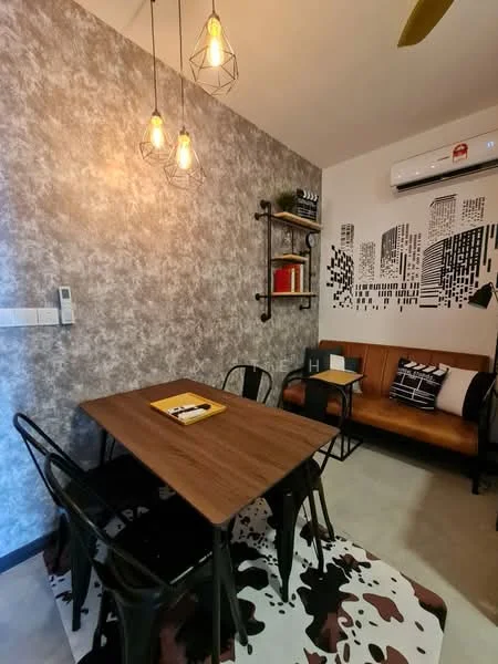 Dining features: wooden dining table, four black metal chairs, pendant lighting with exposed bulbs, grey textured accent wall, air conditioning unit on wall, decorative wall shelf with books, black and white cityscape wall art, brown leather sofa, decorative cushion on sofa, cowhide area rug, concrete flooring; style: modern.