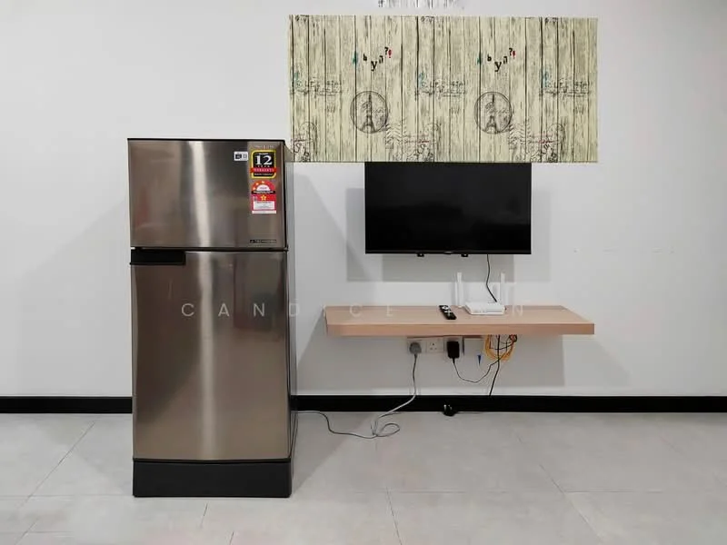 Room features: stainless-steel fridge, wall-mounted TV, floating shelf, cable management, grey tiled flooring, white painted walls, decorative wall art; style: modern.