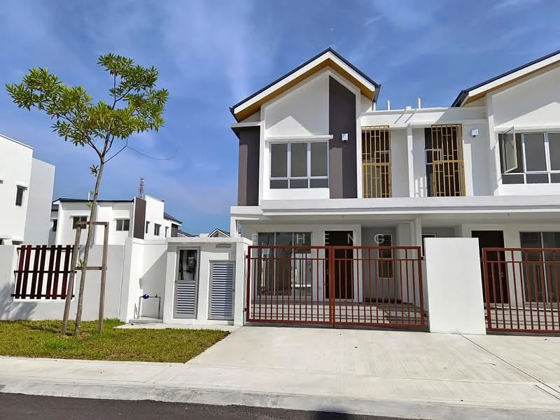 Exterior type: linked terrace house; features: white painted facade, grey accent wall, flat roof, double-storey, manicured lawn, fenced front yard with red metal gate, paved driveway, surrounded by greenery, large windows, balconies on upper floor; style: modern.