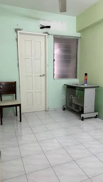 Room features: light green painted walls, white tiled flooring, single wooden chair, white door with panel design, sliding window with metal frame, small grey table with wheels, clean surface on table, ceiling fan; style: minimalist.
