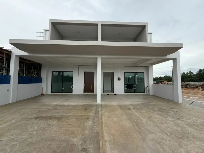 Exterior type: detached bungalow; features: white painted facade, flat roof, large glass windows, double main entrance doors, concrete flooring, overhang roof, minimalist design, surrounded by construction site; style: modern.